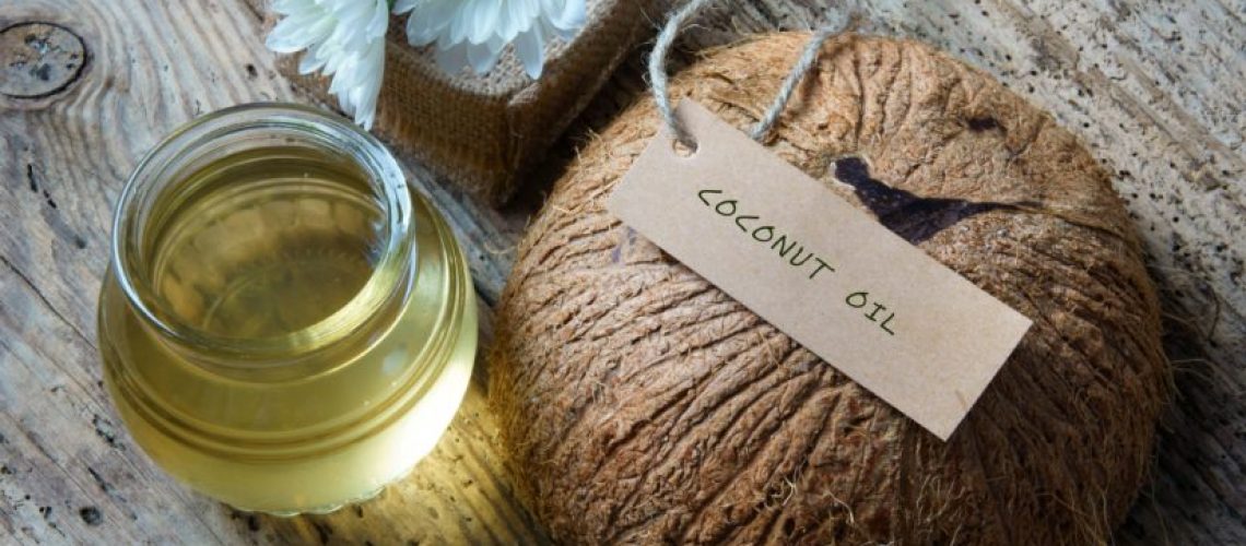 Coconut oil, essential oil from nature, a skin care that safe, rich vintamin, use in massage at spa, organic cosmetic on wooden background